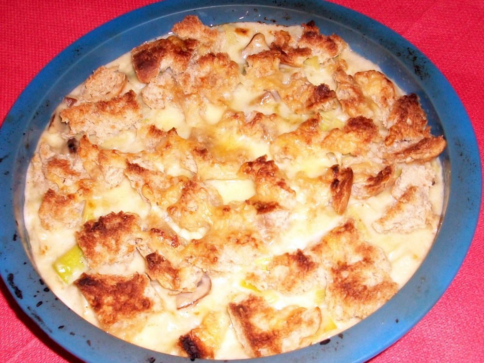 My offering- butter fried leaks and chestnut mushrooms in a pretty heavy cheese sauce with plenty of nutmeg, topped with more cheese and bread chunks then baked. I love this, and make it often and yes, it is absolutely worth the calories. Well received by my fellow foodies. 